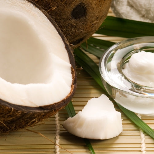 Kokos Waxmelt – geurblokje van sojawas met tropische geur van verse kokos. Foto van open kokosnoot met kokosolie.